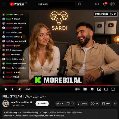{ "type": "YouTube livestream UI", "top_nav": { "logo": "YouTube Premium", "search": "{argument name=\"search query\" default=\"bilal fraiha\"}", "icons": 3 }, "player": { "subjects": [ "{argument name=\"female guest\" default=\"Sydney Sweeney\"} in white cardigan", "bearded man in beige jacket laughing" ], "bg": "couch, 2 silver play buttons, ram logo 'SARDI'", "overlays": { "chat": {"pos": "left", "count": 15, "desc": "colored usernames, white text"}, "goal": {"pos": "top right", "text": "TONIGHT'S GOAL: 0 to 25"}, "banner": {"pos": "bottom center", "text": "K {argument name=\"streamer name\" default=\"MOREBILAL\"}"} }, "controls": {"count": 10} }, "details": { "title": "{argument name=\"video title\" default=\"FULL STREAM | سيدني سويني مع بلال\"}", "channel": "{argument name=\"channel name\" default=\"More Bilal No Filter\"}", "buttons": 5 } }